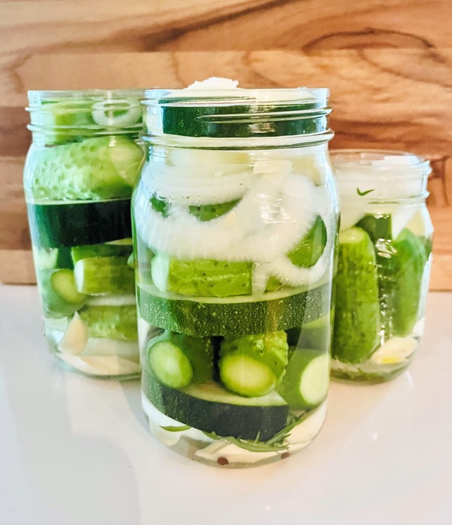 pour freshly boiled water over the vegetables packed in jars, steep