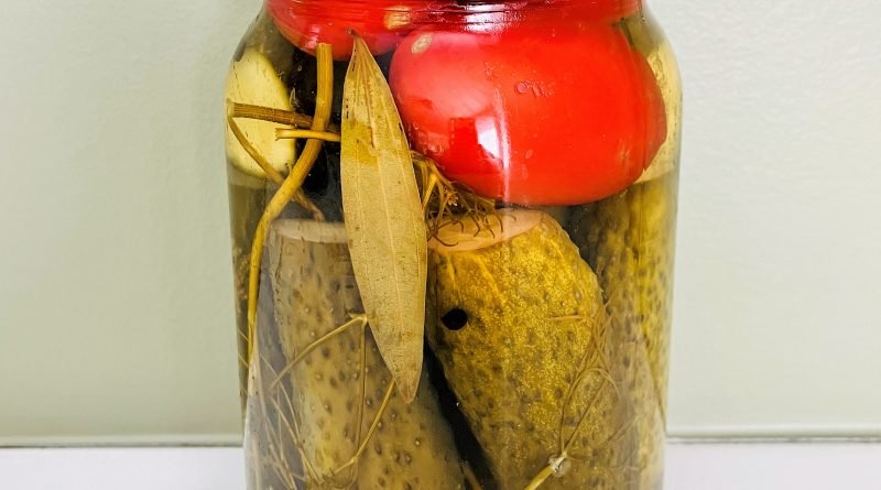 Tomatoes and dill pickles in one jar. Deliciosly crunchy!