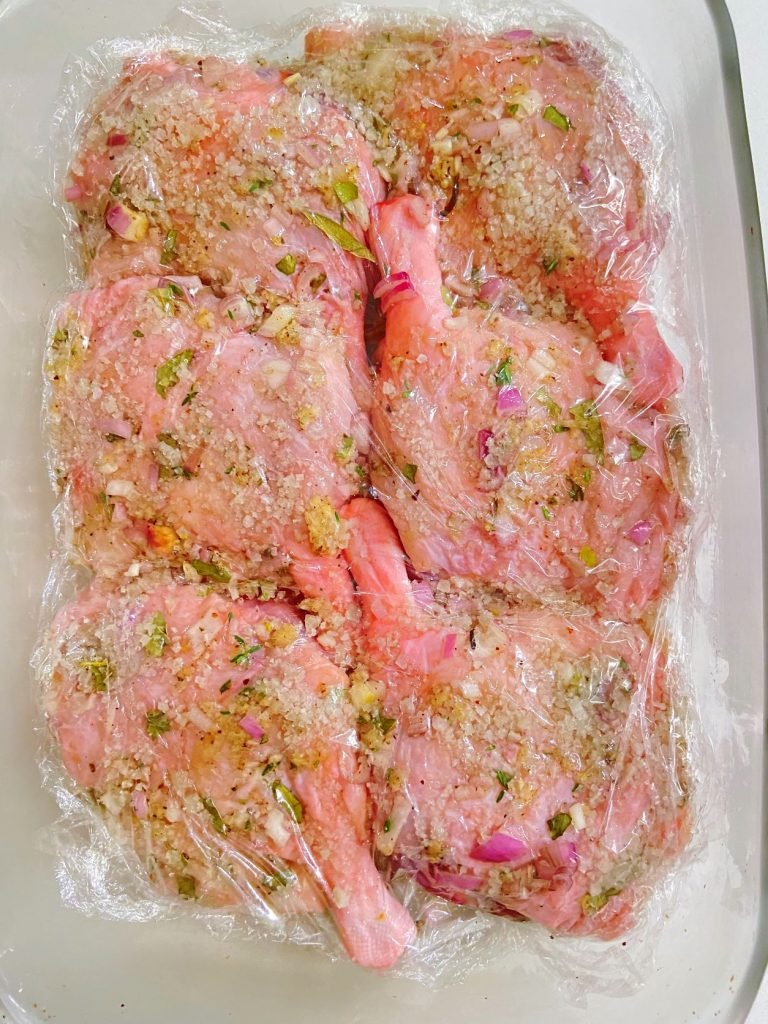 place cling wrap over duck legs covered in  curing mix