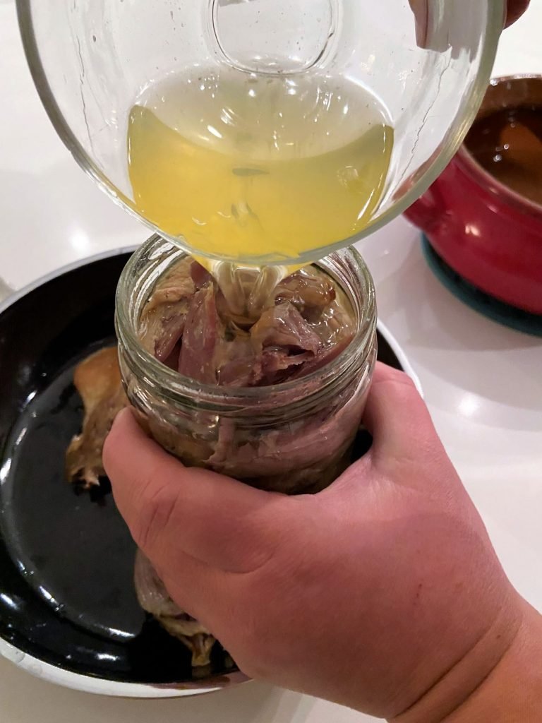 submerge duck confit in rendered duck fat