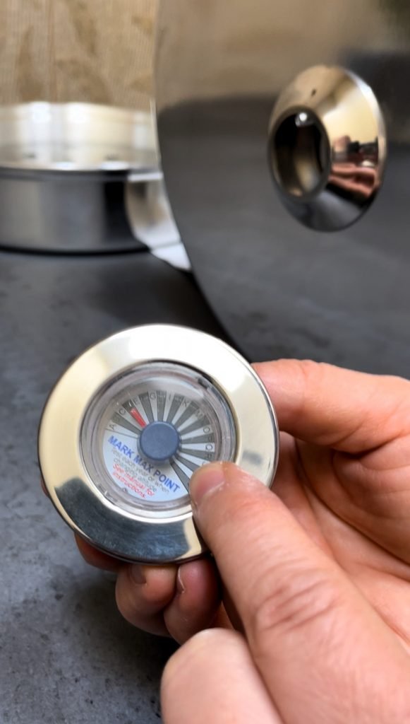 assemble the temperature indicator before you start attaching it to the lid