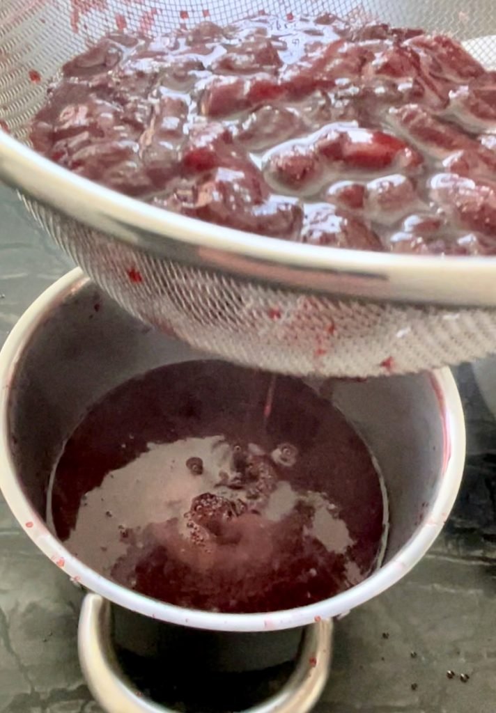 use fine mesh strainer to strain rendered strawberry juices