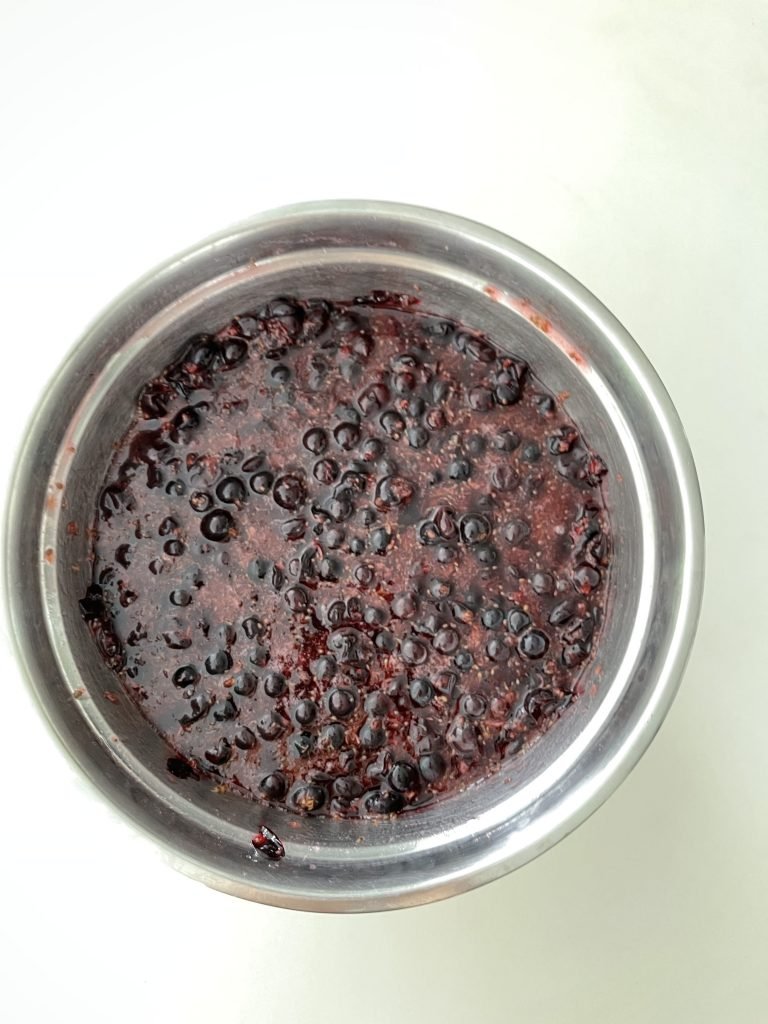 mashed blackcurrants mixed with sugar after the resting period 