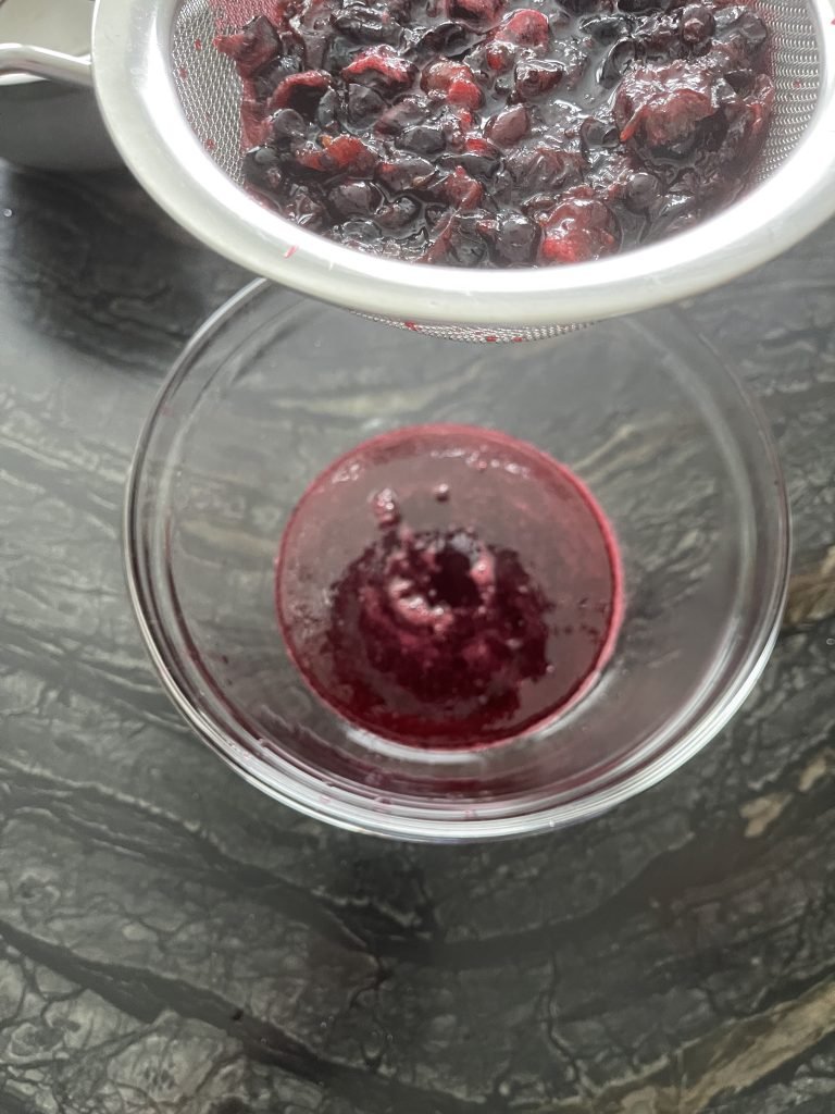 strained blackcurrant juice